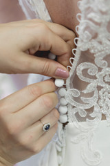 Detailed shot on closing lace wedding dress