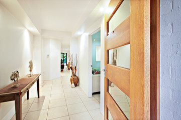 Wooden table and door near home entrance