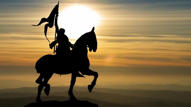 Joan of Arc or Jeanne d'Arc Bronze Equestrian Statue in Paris at Sunset; is considered a Heroine of France for her role during the Lancastrian phase of the Hundred Years' War, and was canonized as a R