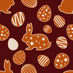 Schilderijen op glas Seamless Happy Easter vector pattern. Figures from gingerbread on a brown background. Festive spring. Can be used for wallpaper, textile, invitation card, wrapping, web page background. © lazininamarina