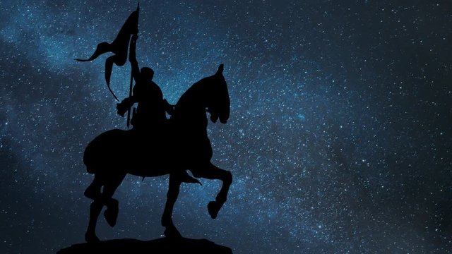 Joan of Arc or Jeanne d'Arc Bronze Equestrian Statue in Paris by Night with Stars and Milky Way; is considered a Heroine of France for her role during the Lancastrian phase of the Hundred Years' War, 