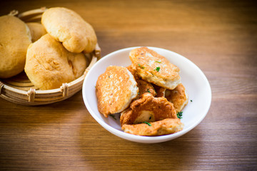 fried chicken cutlets in a white bowl