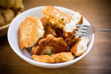 fried chicken cutlets in a white bowl