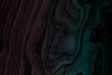 Abstract black wood panel with neon blue and pink texture background