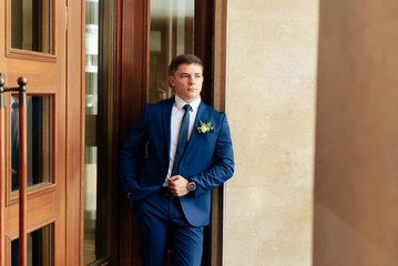 the groom in a wedding suit, a man preparing for the wedding 1