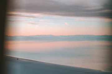 Italian Alps view through airplane window