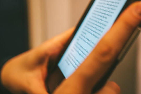 Hand holding electronic reader