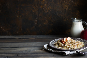 Buckwheat porridge with milk, apple, raisins and cashew nuts
