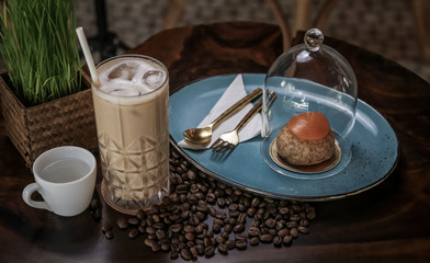 Iced coffee in a tall glass. Iced cafe latte or cappuccino