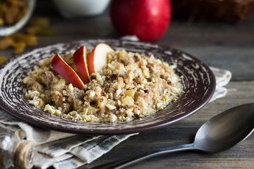 Buckwheat porridge with milk, apple, raisins and cashew nuts