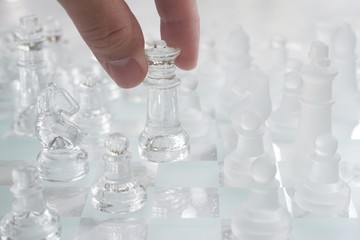 Chess board game made of glass, business competitive concept