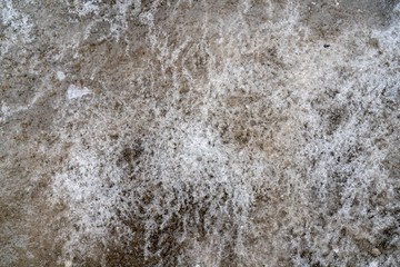 Ice crust on the road surface.