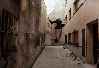 young sportsman practicing parkour.