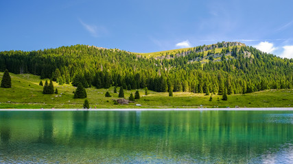 Panorama, landscape of a  turquoise lake in Italy. Passo Coe Lake, Folgaria, Trento, Trentino, Italy - August 2018 - obrazy, fototapety, plakaty