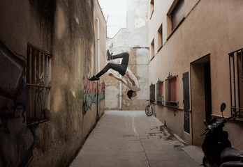 young sportsman practicing parkour.