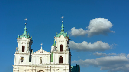 Fototapeta premium Grodno. Belarus. The domes of the Church of St. Xavier on the background of blue sky with white clouds.