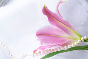 Obraz na płótnie Canvas Pink lily and pearls. Wedding background