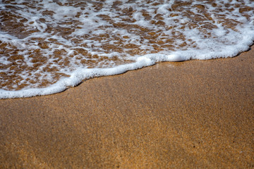Soft wave on sandy beach