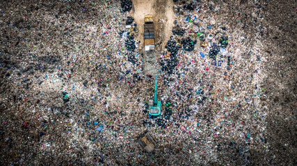 Garbage pile  in trash dump or landfill, Aerial view garbage trucks unload garbage to a landfill, ...