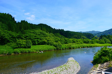 Fototapeta na wymiar 日本の風景。山間地の清流、夏の気仙川。陸前高田　岩手　日本。７月上旬。