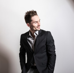 Handsome young elegant man in costume.