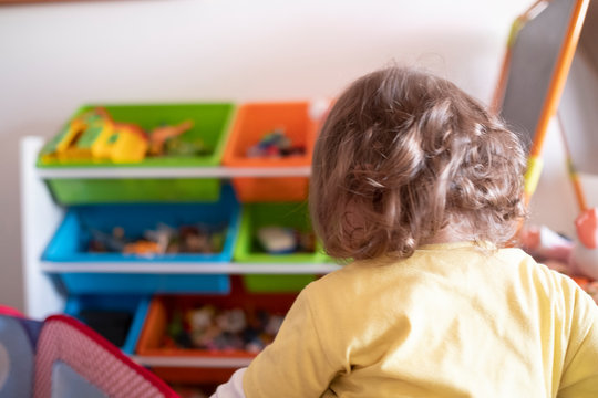 baby girl backwards in a games room
