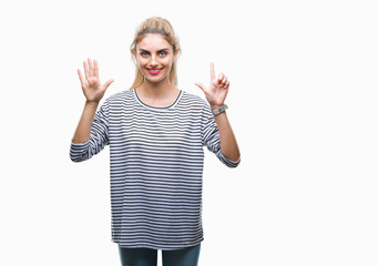 Young beautiful blonde woman wearing stripes sweater over isolated background showing and pointing...