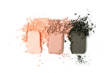 A broken pink gradient colored eye shadows isolated on a white background. Top view, flat lay. Copy space for your text