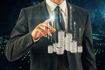 Double exposure with growth coins columns and man hand. Concept of success savings and capital.
