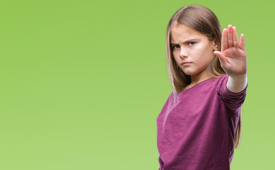 Young beautiful girl over isolated background doing stop sing with palm of the hand. Warning expression with negative and serious gesture on the face.