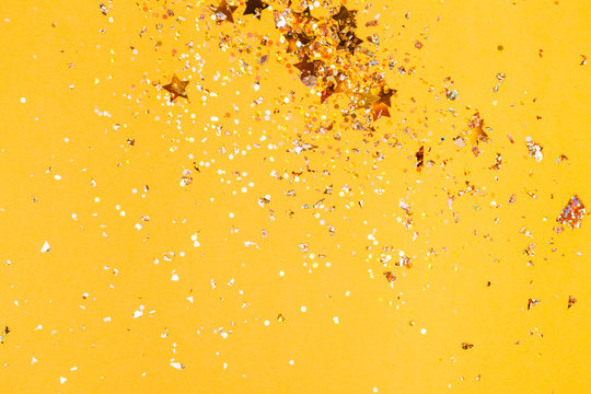 Colorful Yellow Confetti Background. Vibrant And Holiday. Top View, Flat Lay.