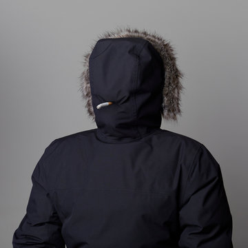 Man smoking in hood