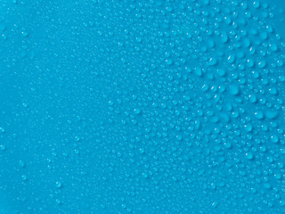 Fototapeta na wymiar water droplets on blue background