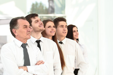 successful business team looking at copy space.