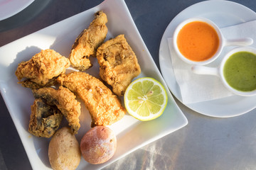 Fried moray eel with salt potato, accompanied by mojo picon and green mojo. Typical dish of the...