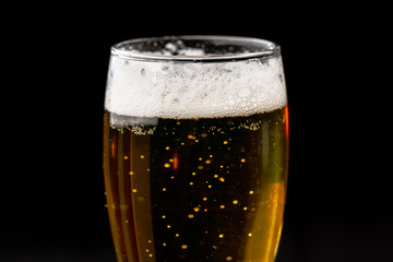 A glass of beer on a black background large - 251828294