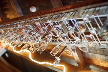 glasses hang on the bar