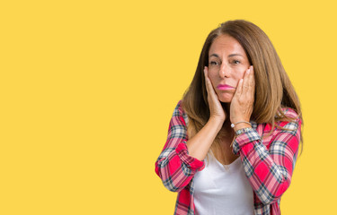 Beautiful middle age woman wearing over isolated background Tired hands covering face, depression and sadness, upset and irritated for problem