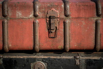 Old vintage antique suitcases trunks in a stack background 