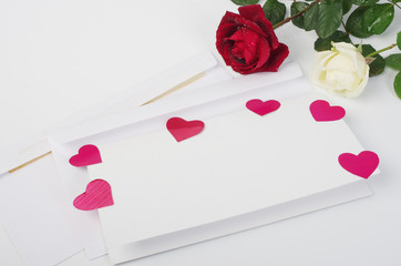 Love letter. Envelope, pen, red hearts and a rose.