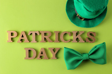 St.Patrick 's Day. celebration. A green bow tie, a leprechaun hat  and the text of March 17 on a...