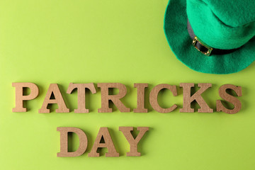 St.Patrick 's Day. celebration. A green  leprechaun hat  and the text of March 17 on a bright green...