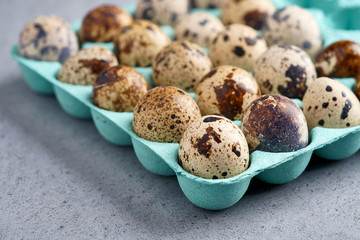 Quail eggs in blue cardboard packaging