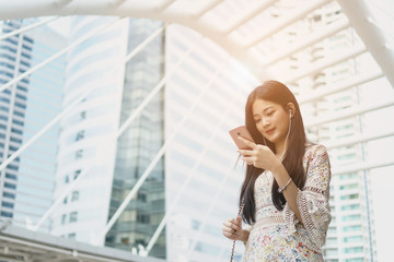 Digital composite of Woman working with the smartphone Online communication. keeping smile on her face and using her gadget while being at work,life style professional concept
