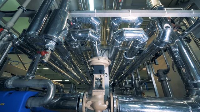 Pipes made of steel located in a brewing factory