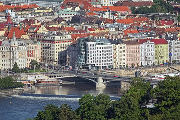 View of Dancing House from Petrin Lookout Tower in Prague, Czech Republic. The Dancing House, also...