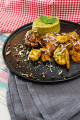 Chicken wings with sauce and golden French fries potatoes