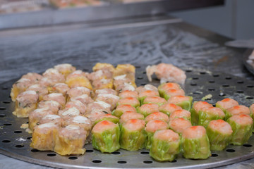 Closeup Dim Sum ,Chinese food steamed dumpling on stainless steel tray background.