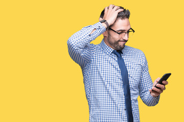 Young business man using smartphone over isolated background stressed with hand on head, shocked...