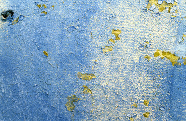 Obraz na płótnie Canvas Old wooden background with remains of pieces of scraps of old paint on wood. Texture of an old tree, board with paint, vintage background peeling paint. old blue board with cracked paint, vintage